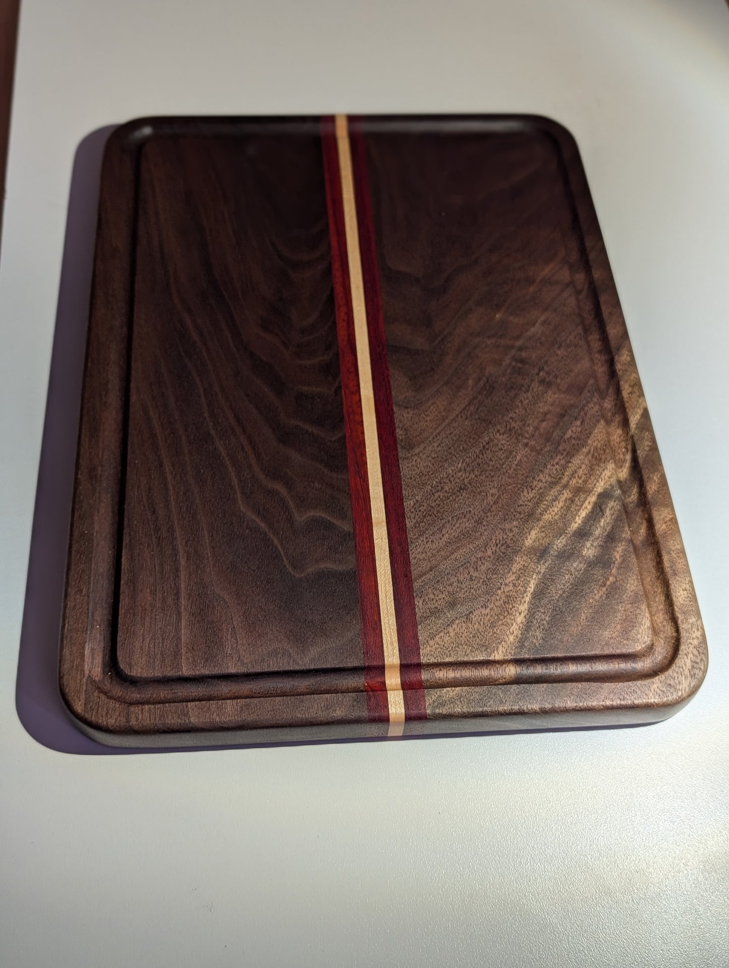 Walnut Paduak and Maple cutting board