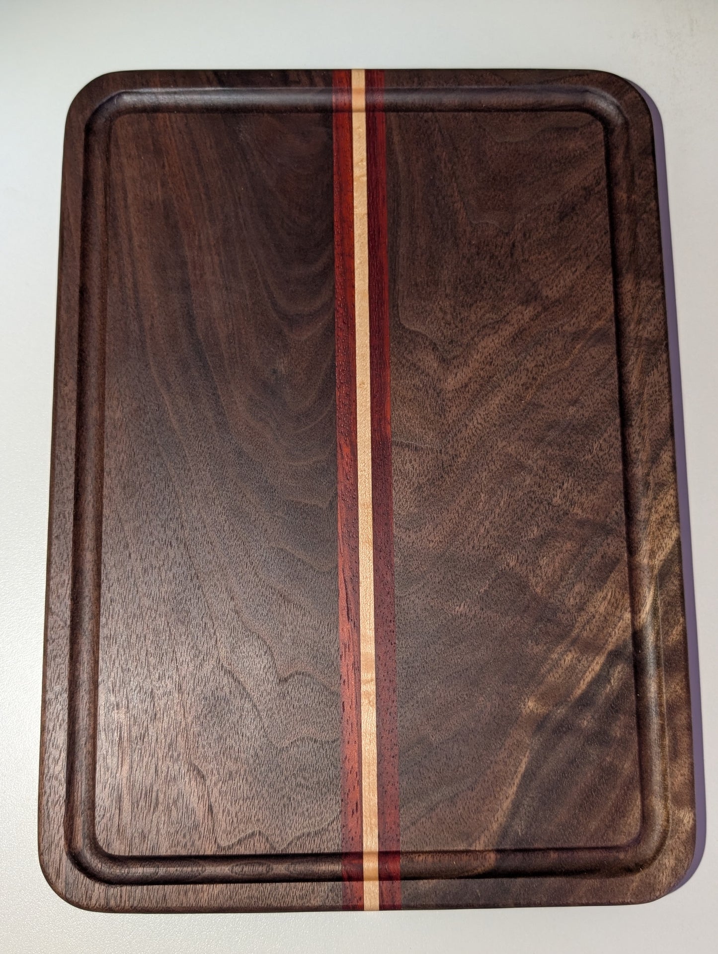 Walnut Paduak and Maple cutting board